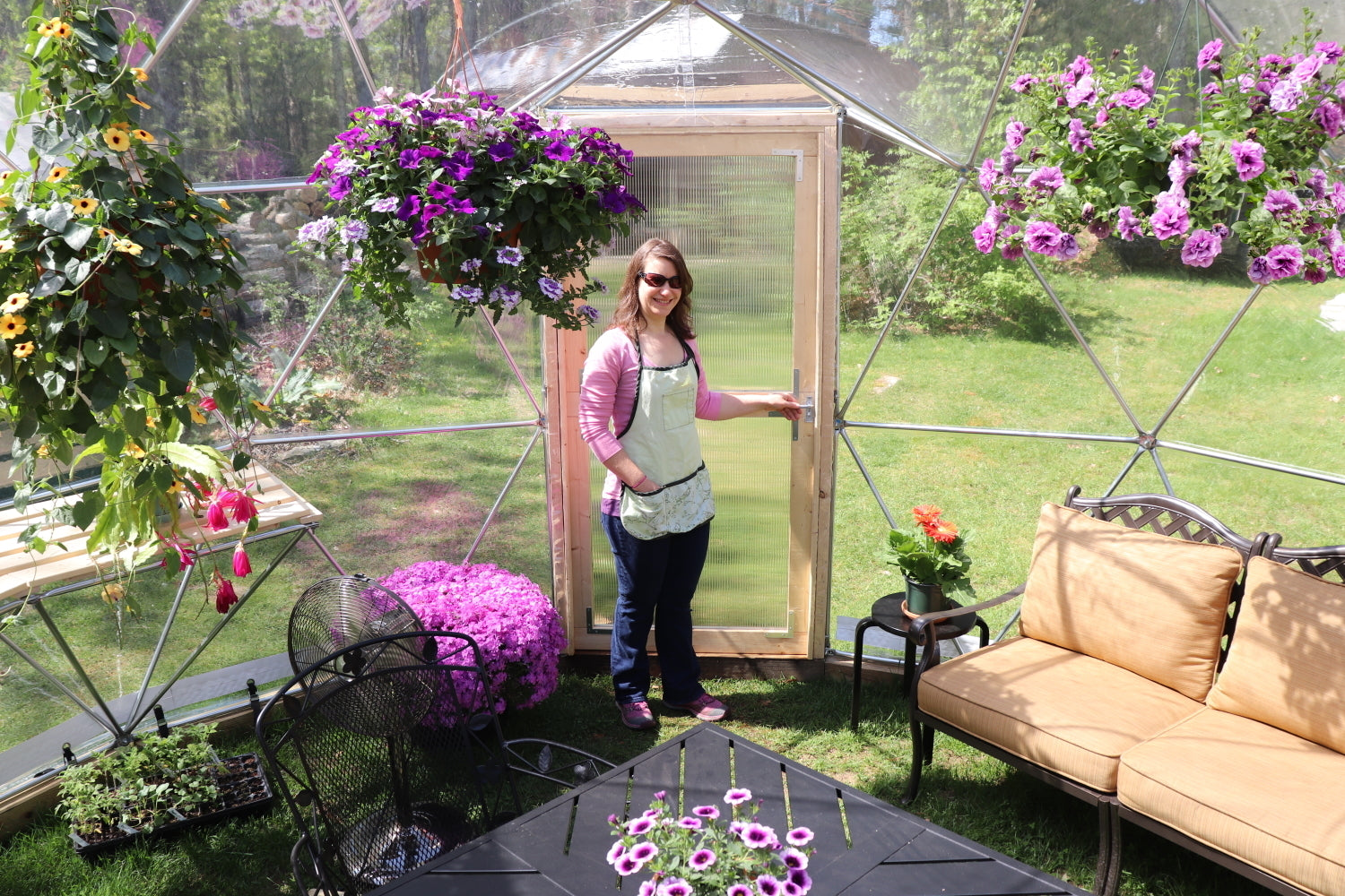 Inside photo of a 16 ft greenhouse providing a view of the door.