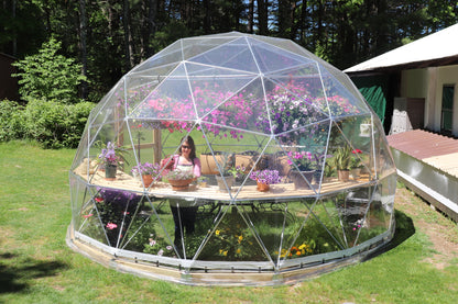 Outside profile photo of a 16 ft greenhouse providing a view of the back.